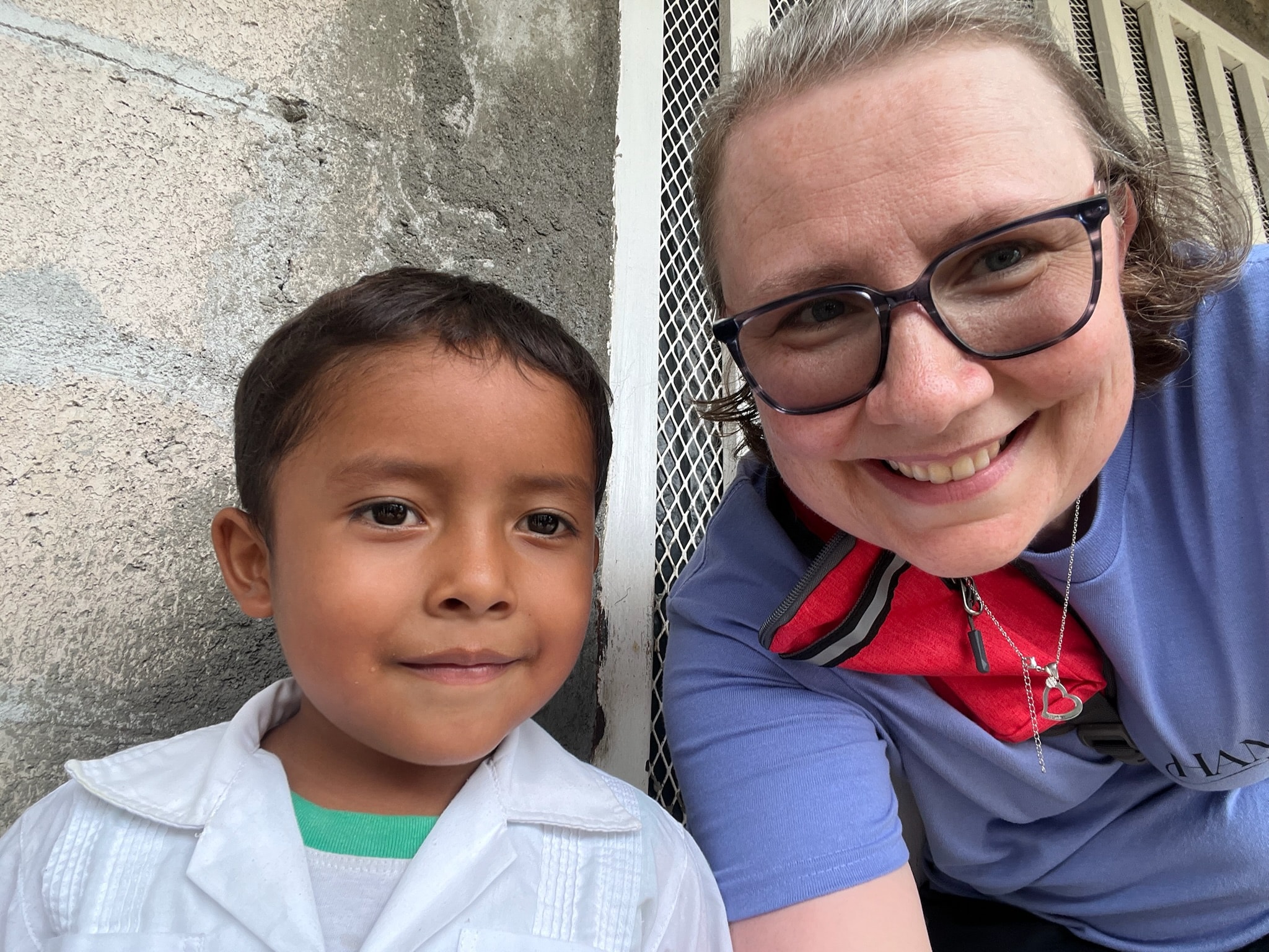 Woman and young boy smiling together