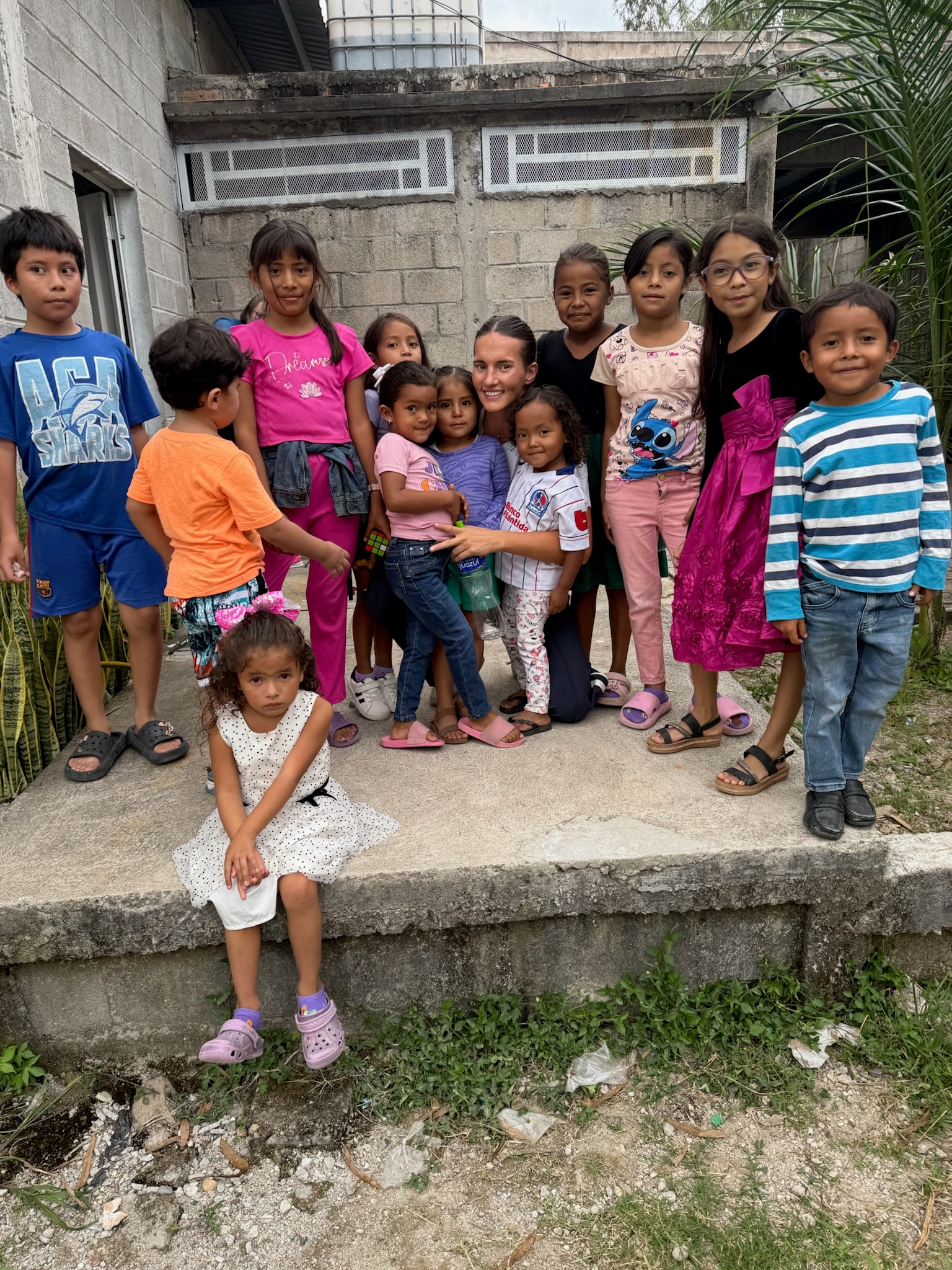 Group of children posing together outdoors